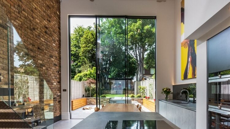 4.5m tall double height sliding glass doors in a luxury London home renovation