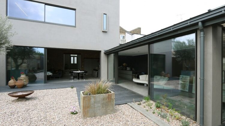 BANNER a three pane slim sliding glass door and a minimal windows biparting sliding glass door