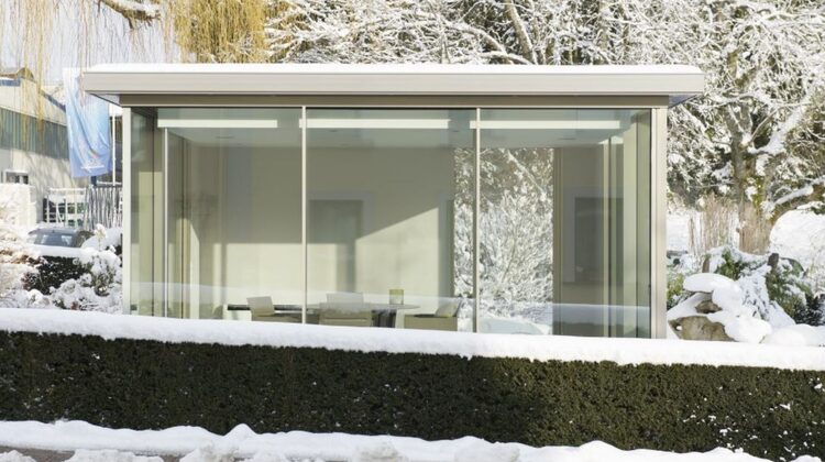 glass box garden room with heated sliding glass doors to prevent show build up and keep the glass box warm