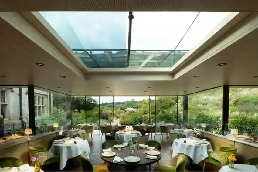 automated sliding rooflight system above a luxury rural countryside hotel restaurant