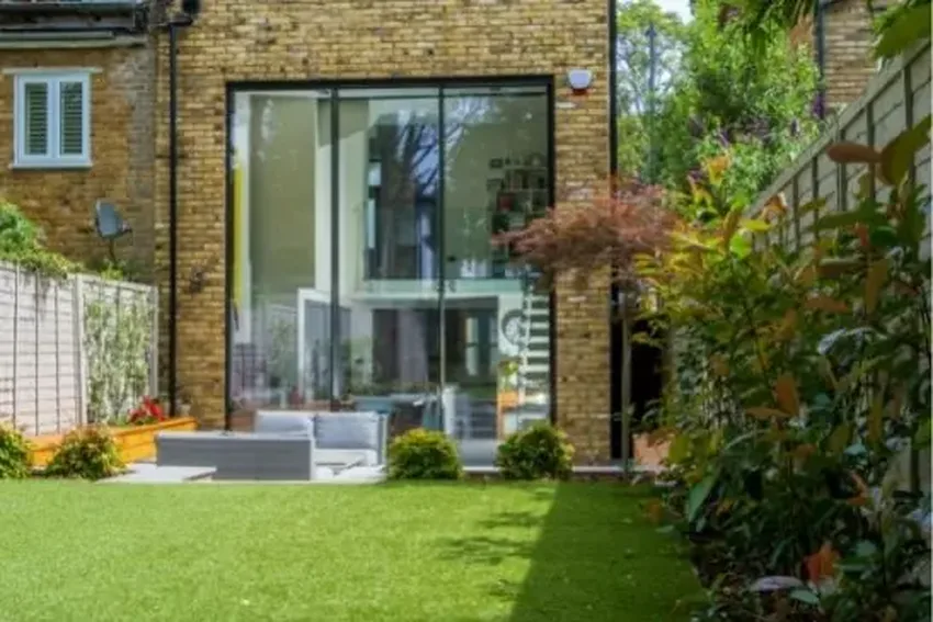 double height slim sliding glass door in a traditional house in London