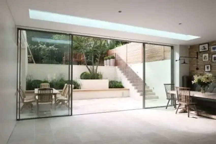 floor to ceiling biparting sliding glass patio doors in a luxury London home