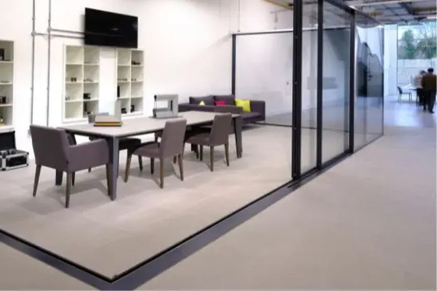 concealed base frame for stepless transition in corner opening sliding glass doors