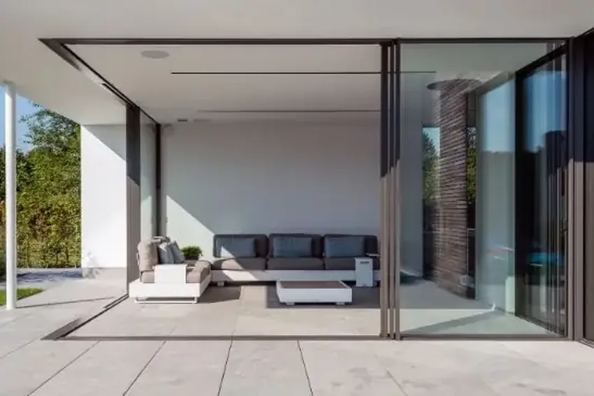 minimal windows slim sliders with brown aluminium framing around the sliding glass doors