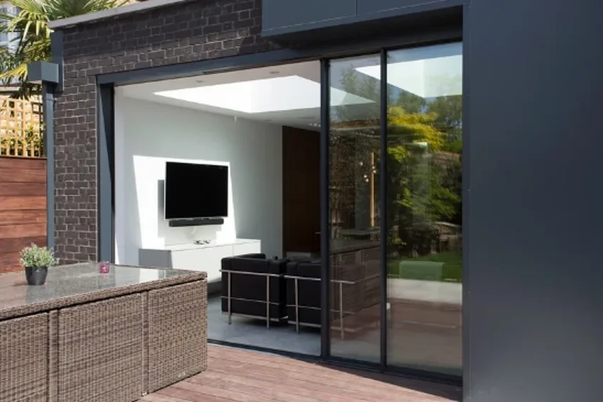 minimal windows three pane sliding glass pocket door partially open