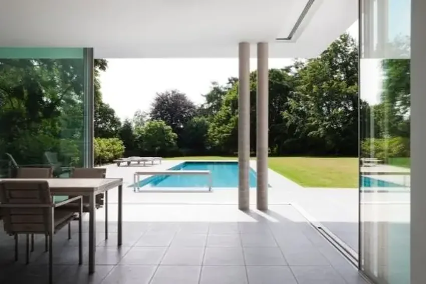 open corner sliding glass doors with concealed head frame and flush threshold to create a completely open aperture