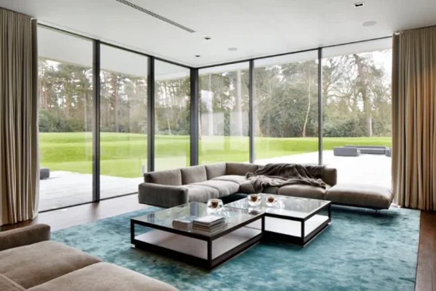 oversized sliding glass doors in a luxury new build home in surrey located in a green belt area