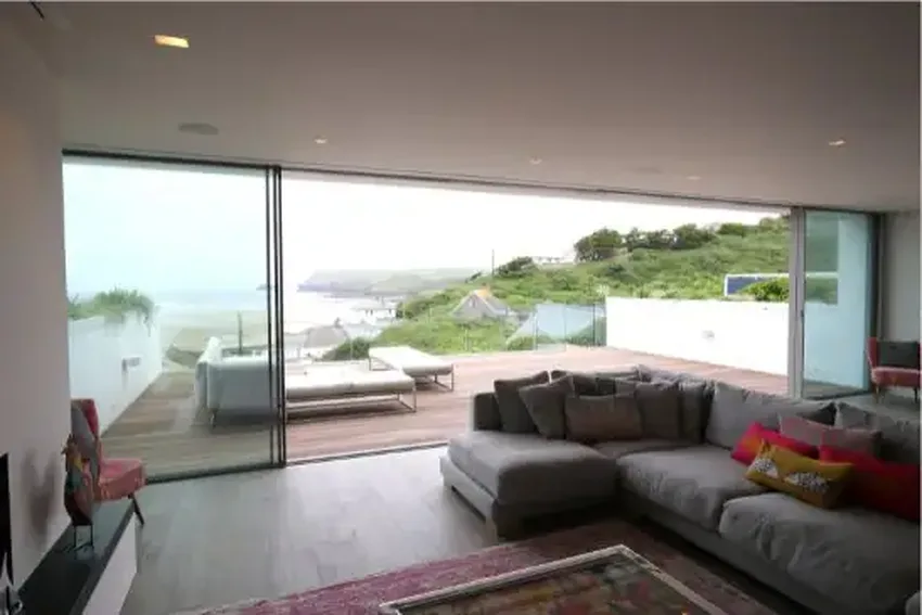 new build cornwall house with large aluminium slim sliding glass doors