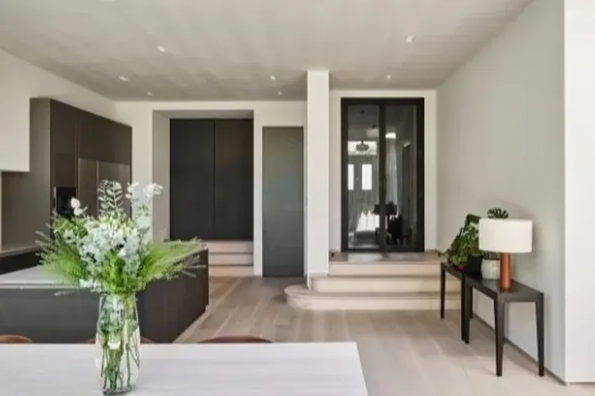 steel frame internal glass door sin a modern home extension that also has minimal windows slim sliding doors