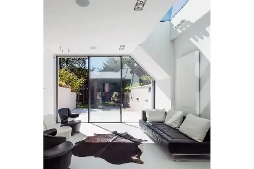 three pane angled minimal windows slim sliding door with fixed strip rooflight