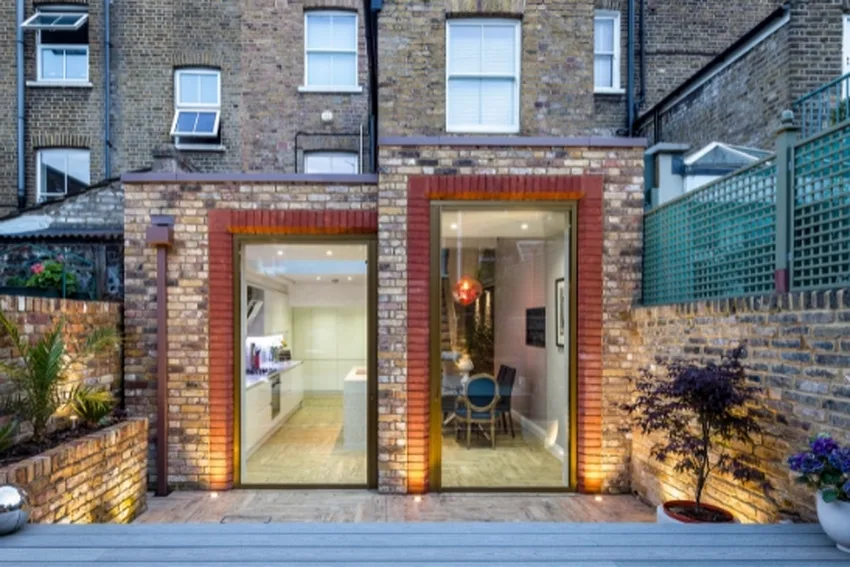 two bespoke aluminium pivot doors in a London terraced home renovation