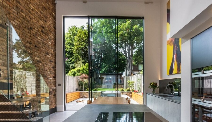 4.5m tall double height sliding glass doors in a luxury London home renovation