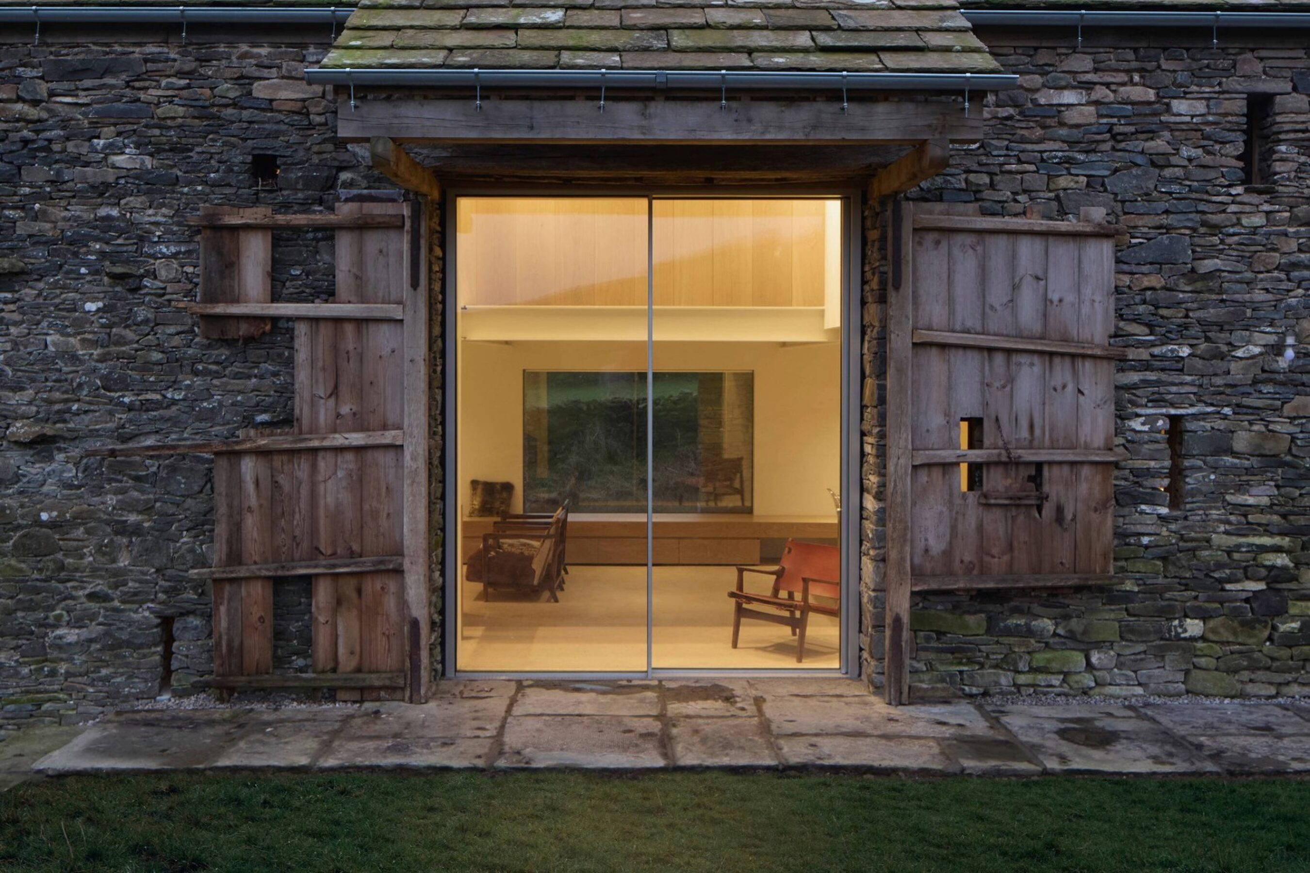 Twilight View of Triple Glazed Sliding Doors in Cumbria | Bank Barn
