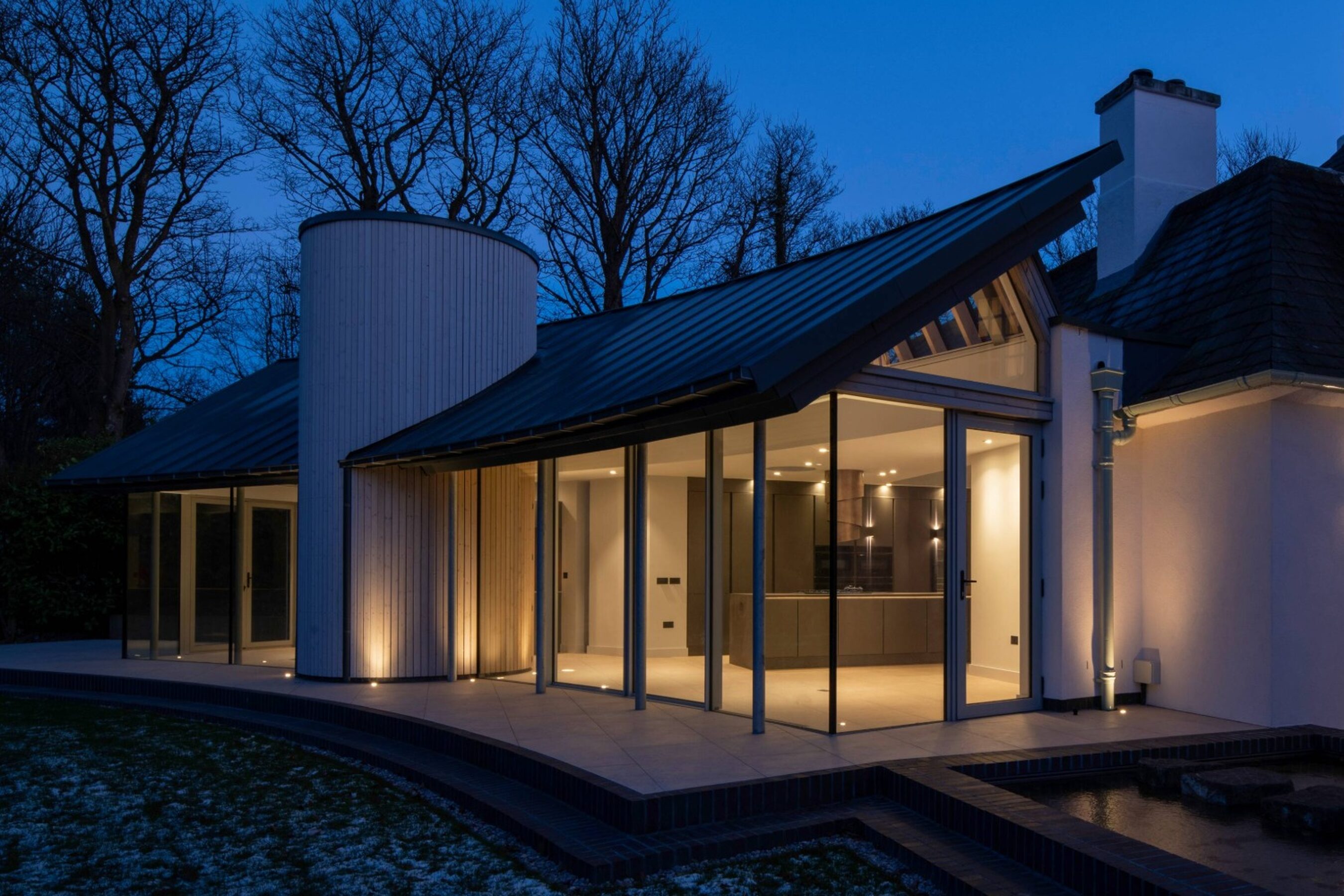 Evening View from the Side of Glenwood Curved Sliding Doors in Scotland