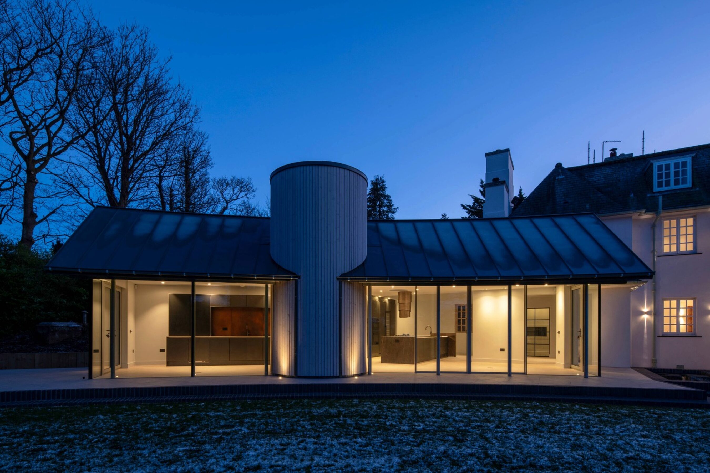 Evening View of Glenwood Curved Sliding Doors in Scotland