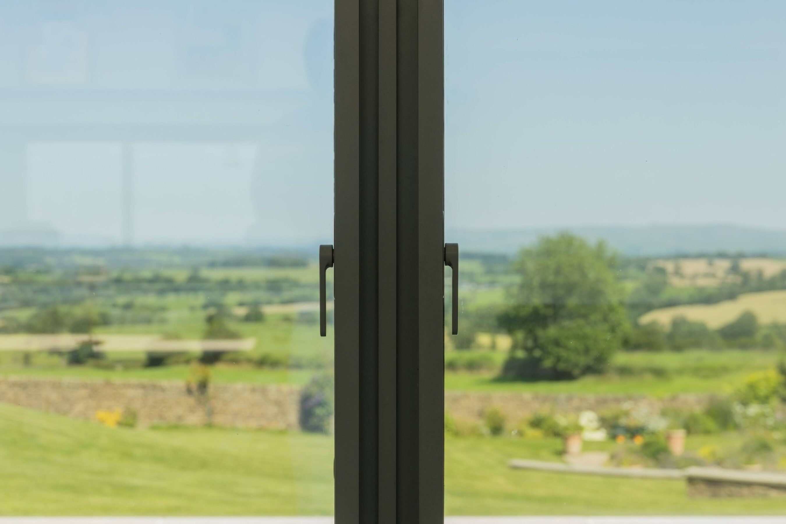 Bi-parting Handle Locks on Triple Glazed Sliding Doors in Lancashire | Martin Top Farm