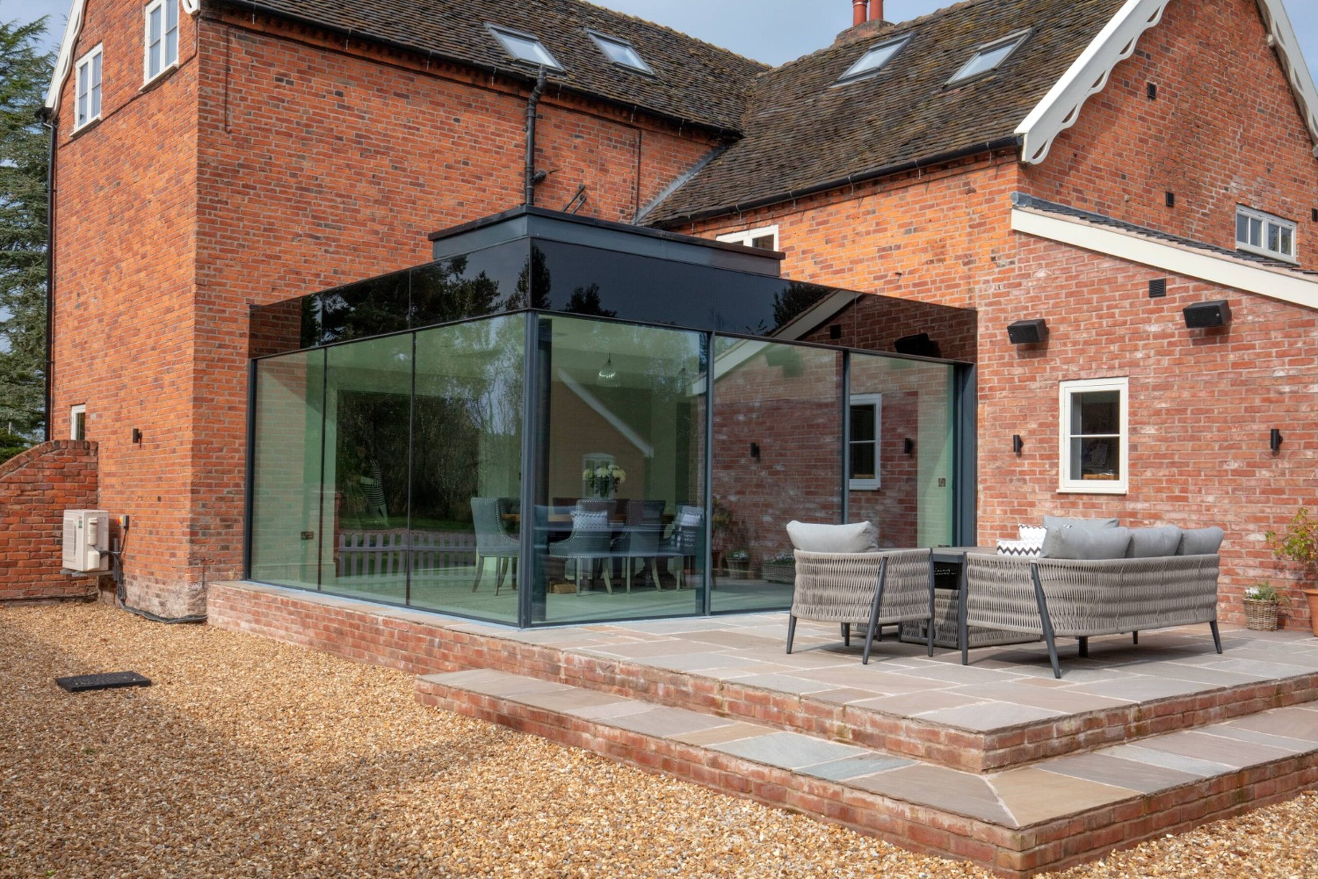 Patio View of Glass Extension with Sliding Doors in Cheshire | Illidge Green