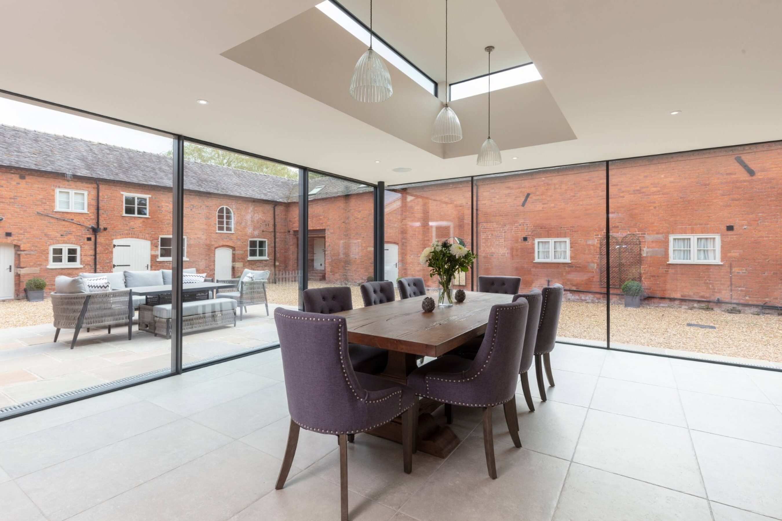 Dining Room View of Glass Extension with Sliding Doors in Cheshire | Illidge Green