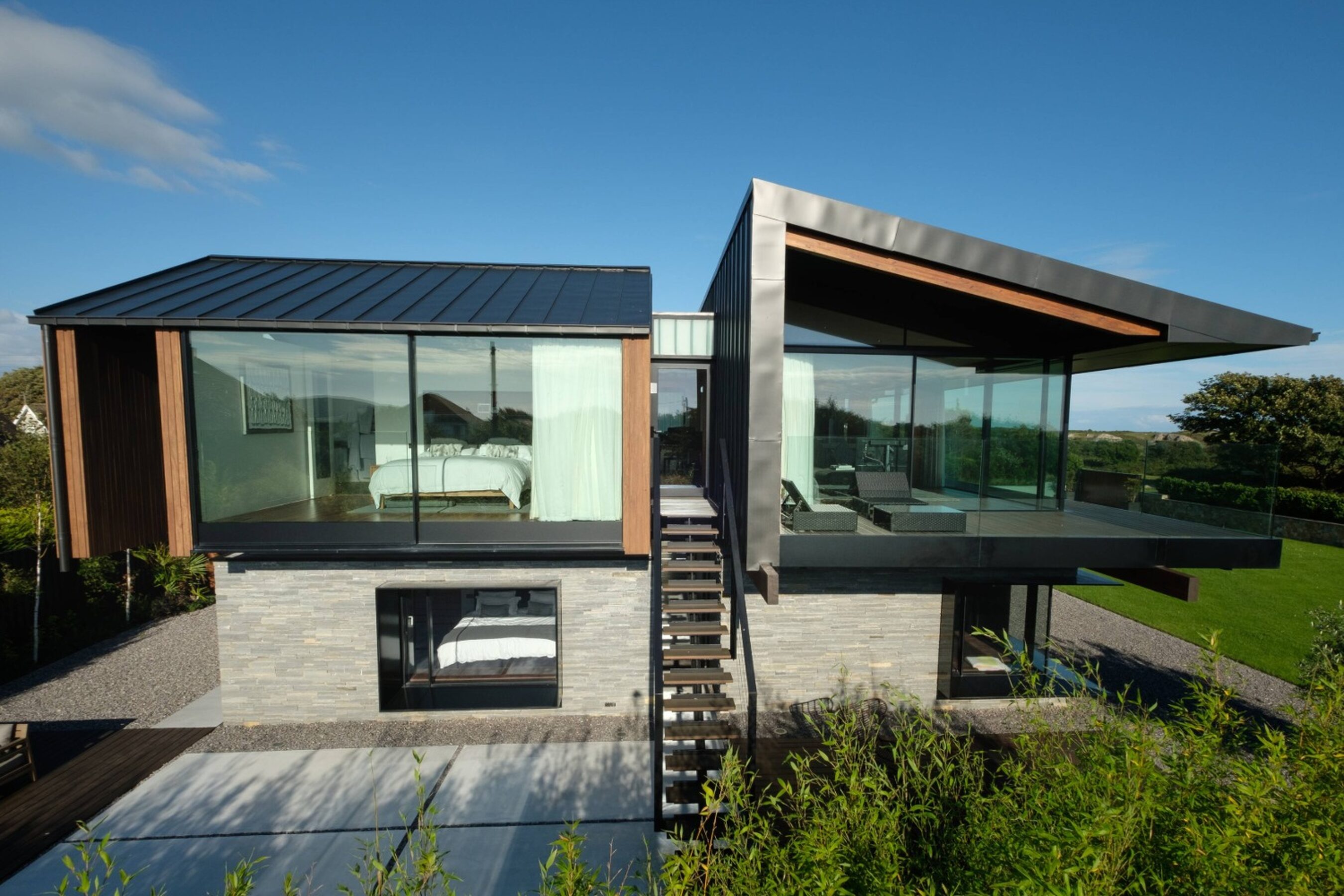 Side elevation view of glass sliding doors in Wales | Silver House