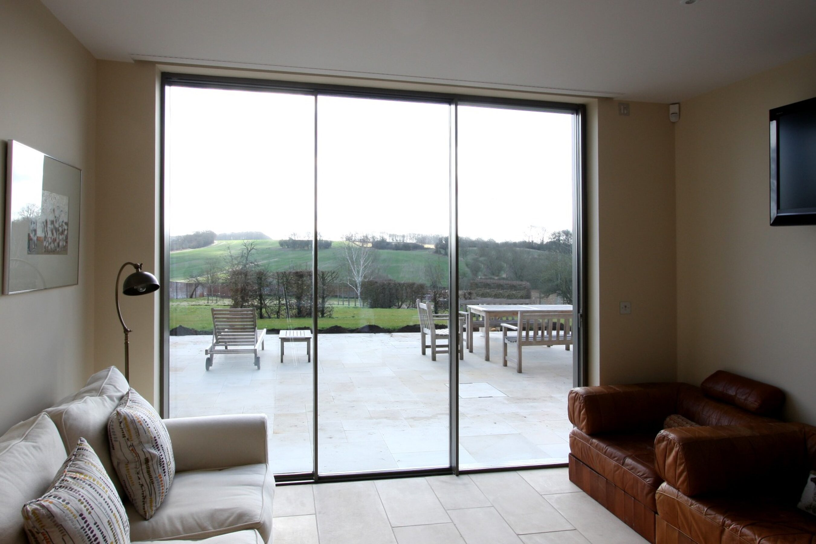 Lounge View of Slim Sliding Doors in Warwickshire | Wall House