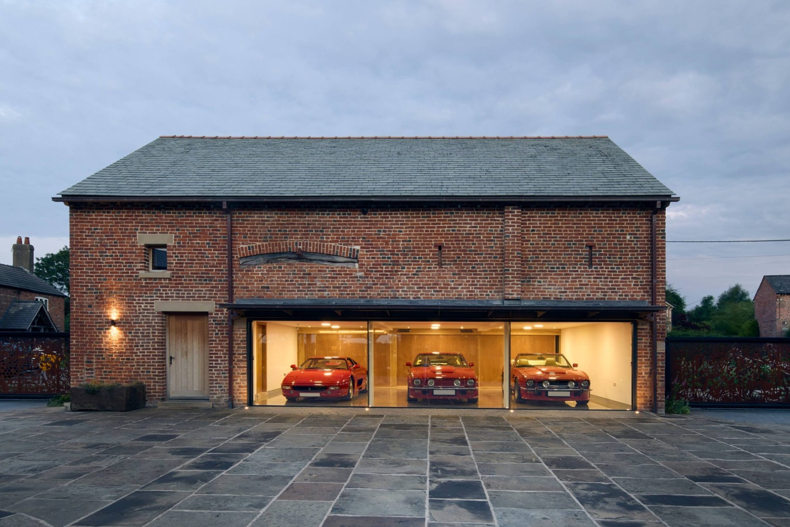 Twilight View of Garage Slim Sliding Glass Doors in Cheshire | Fodens Farm