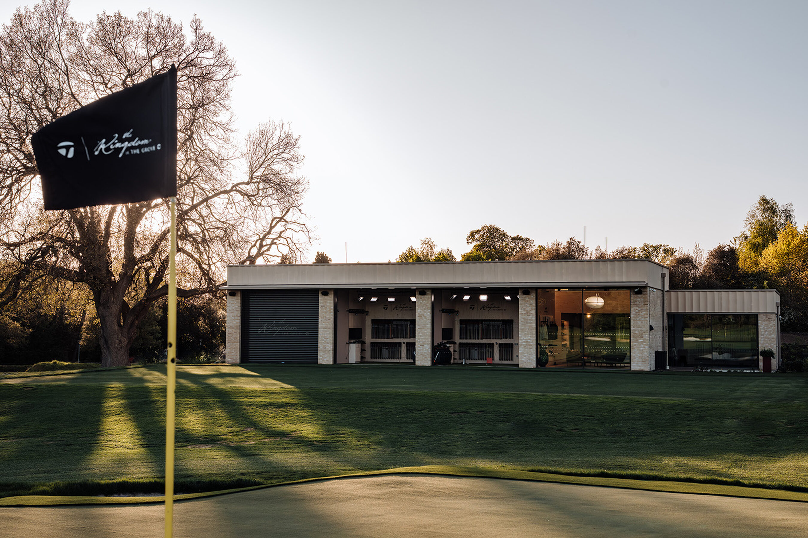 The Kingdom at the Grove - minimal windows - Large sliding glass doors for sports architecture