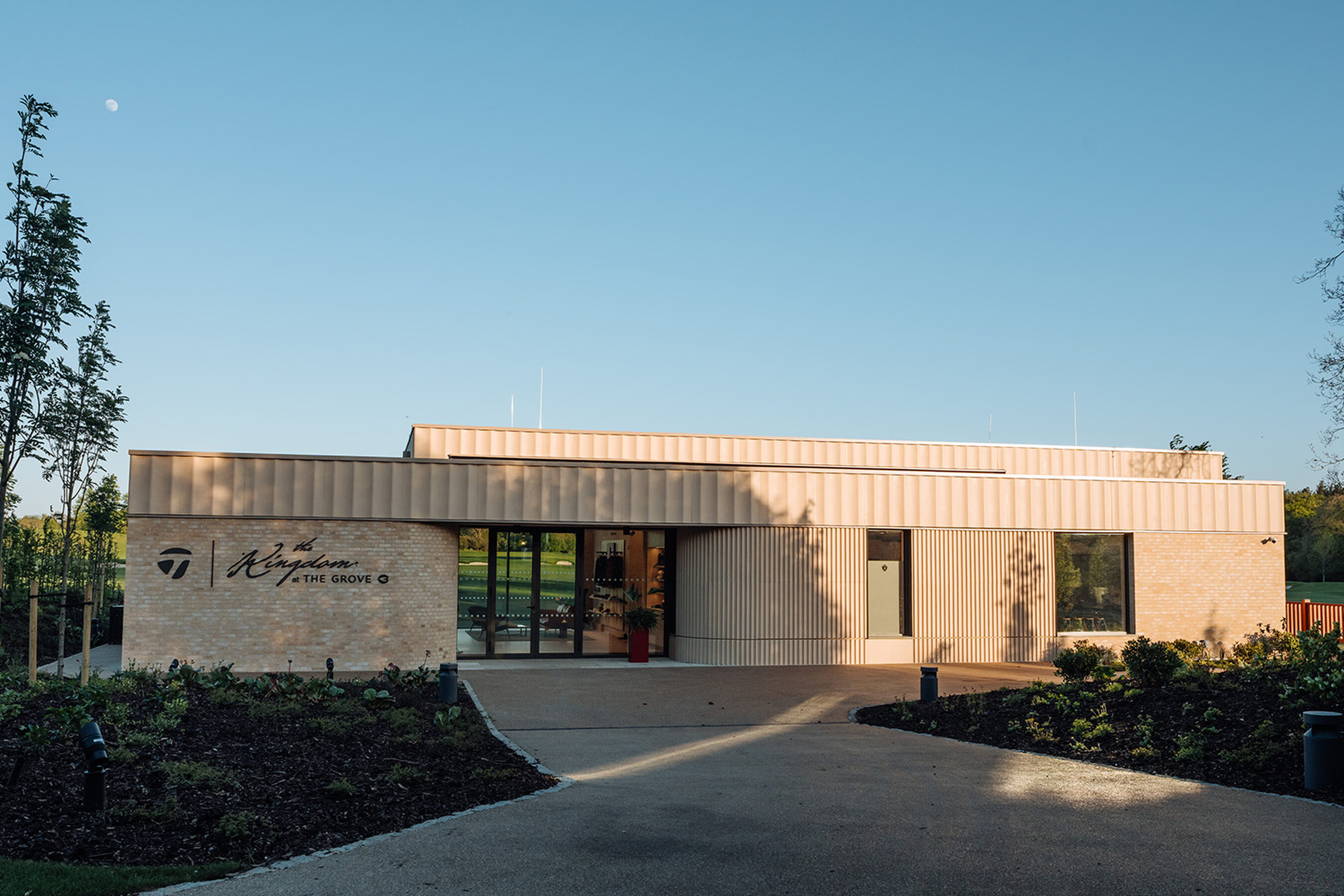 The Kingdom at the Grove - minimal windows - Large sliding glass doors for sports architecture