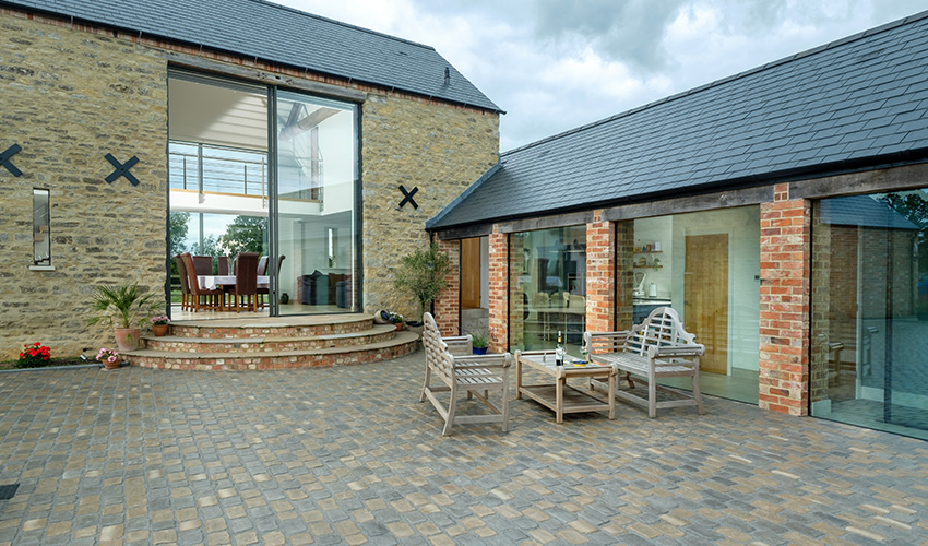 minimal windows - 6m tall doors - Coolington Barn