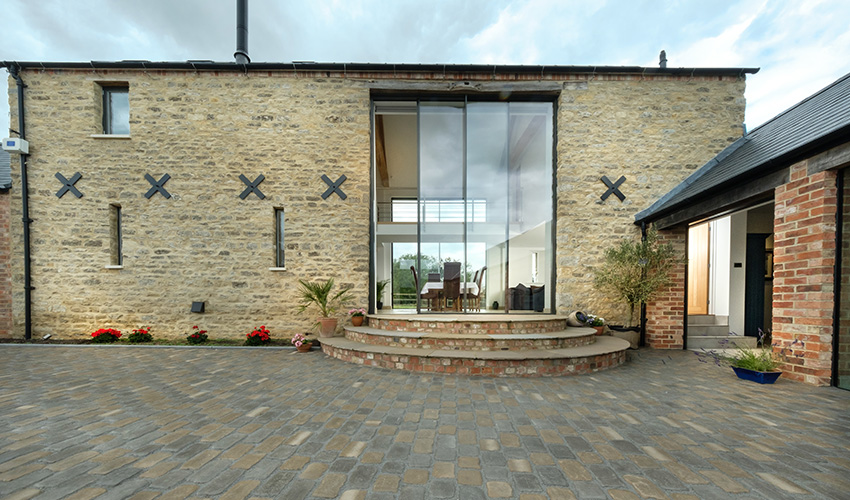 minimal windows - 6m tall doors - Coolington Barn